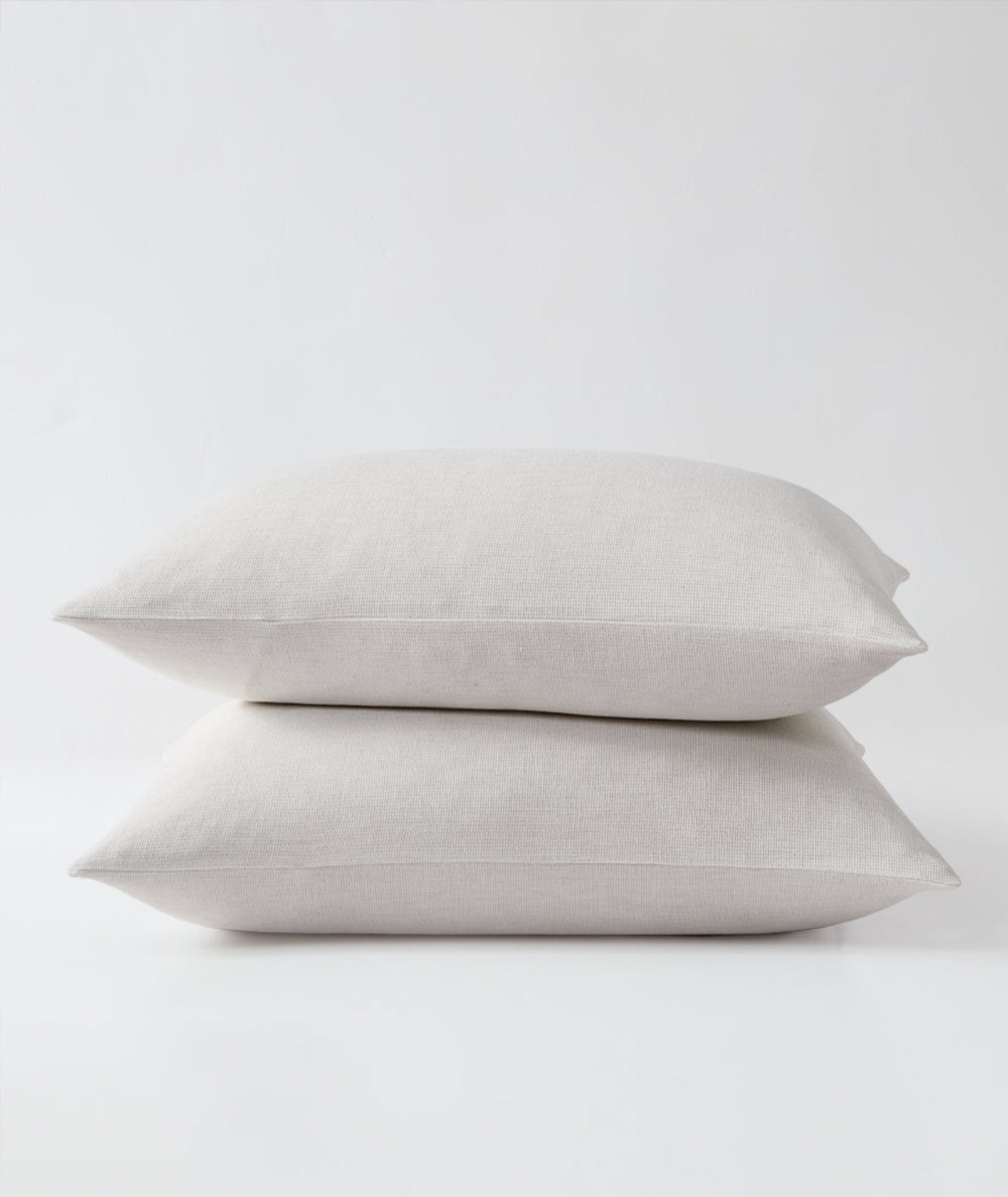 Stacked pair of Harriet Home CoCashmere shams in Ivory, illustrating the soft micro waffle texture.